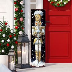 a door decorated with a nutcracker standing in front of a christmas tree and wreath