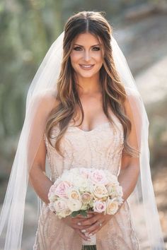 a woman in a wedding dress holding a bouquet