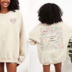 Get ready to explore the world in style with this chic, travel-themed crewneck sweatshirt! Featuring a unique design filled with colorful passport stamps from destinations around the globe, this sweatshirt captures the essence of wanderlust. The playful twist on the classic phrase "All you need is love" with the word "love" crossed out and replaced by "a passport" reflects the adventurous spirit of travel lovers. Please use the sizing guide for additional guidance on sizing! This Sweatshirt is a Unisex-style, so it has a smaller fit than men's sizing, but a little larger fit than women's sizing. Please size up 1-2 sizes for the Oversized Look. This design is an original, created by Sarah Scheiner @ She's Speaking Designs. She uses digital graphic design elements along with various fonts an Travel Sweater, Passport Stamps, Crewneck Vintage, Digital Graphic Design, Graphic Design Elements, Travel Lover, Travel Themes, Flight Attendant, All You Need Is Love