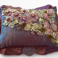 a decorative pillow with flowers on it