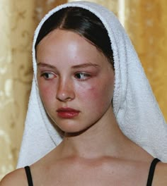 a woman with a towel on her head