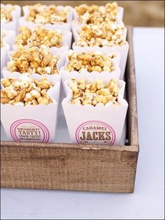 a box filled with lots of popcorn sitting on top of a table