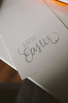 a close up of a piece of paper with the words happy easter written on it