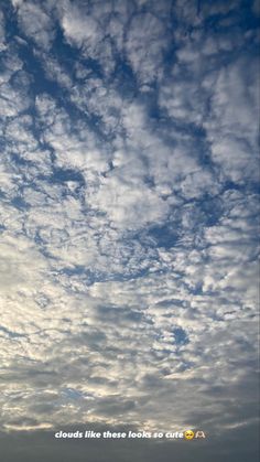 the sky is filled with white clouds and blue skies