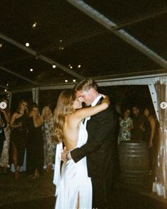 a bride and groom sharing their first dance