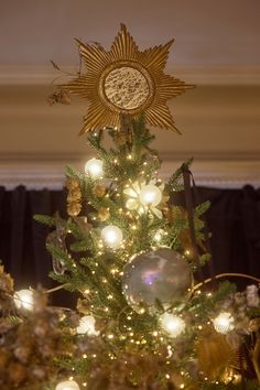 a decorated christmas tree with lights and decorations