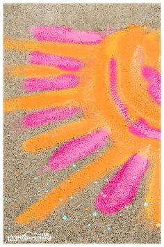 an orange and pink handprint on the ground