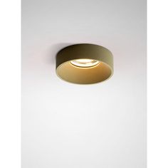 an image of a light that is on in the wall with white walls behind it