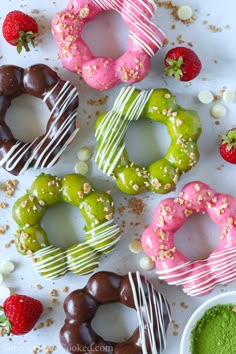 assorted donuts with sprinkles and strawberries