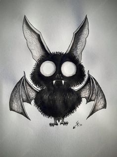 a black and white drawing of a bat with large wings on it's face