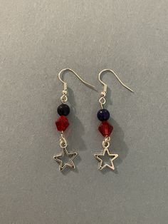 A beautiful patriotic earring set with a star center piece.  The red stone is crystal, the blue stone is jade.   Bracelets for Benjamin. Blue Patriotic Earrings For Independence Day, Patriotic Blue Earrings For Independence Day, Patriotic Red Star-shaped Earrings, Patriotic Adjustable Dangle Jewelry, Nickel Free Dangle Jewelry For 4th Of July, Silver Jewelry For 4th Of July Gift, Silver Jewelry Gift For 4th Of July, Independence Day Dangle Earrings Gift, Independence Day Dangle Earrings As Gift