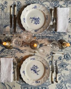 the table is set with blue and white china