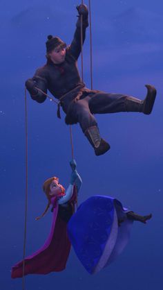 two people hanging upside down on ropes in the air with their feet dangling from them