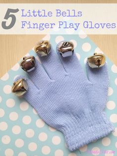 five little bells finger play gloves on top of a table