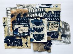 a collage of different types of artwork on a white wall with black and brown colors