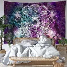 a large tapestry hanging on the wall above a bed in front of a purple and blue background