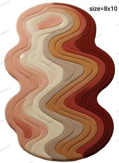 a rug with different colors and shapes on it's side, in the shape of waves