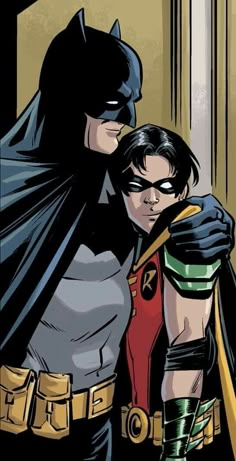 the batman and robin wayne are hugging each other