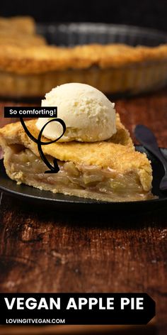 a piece of pie sitting on top of a black plate