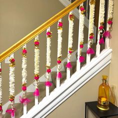 the banisters are decorated with pink and gold decorations