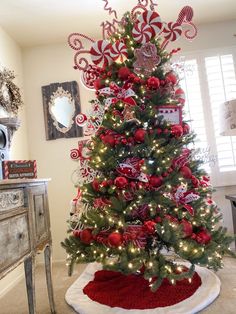 a christmas tree decorated with candy canes and ornaments