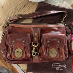 Coach Leather Shoulder Bag- Used Liner Has A Stain (See Photo), There Is Also A Water Spot On The “Back” Of The Bag, Bag Was Used Often And Has Many Signs Of Wear Approximately 14 Inches Long, 8 Inches Wide Purchased Many Years Ago, Think Original Cost Was Approximately $1000; Asking $150 Coach Brown Soft Leather Shoulder Bag, Brown Coach Shoulder Bag With Branded Hardware, Coach Rectangular Shoulder Bag With Turn-lock Closure, Versatile Coach Shoulder Bag With Gold-tone Hardware, Brown Coach Bag With Turn-lock Closure, Water Spots, Bags Coach, Coach Leather, Bag Bag