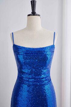 This dress features sequins in a royal blue color and a bodycon silhouette. The top is ruched and the skirt has a ruffle detail. It also has spaghetti straps, a lace-up back, and falls above the knee in length. Item #NP1104 Material: Sequin Color: Royal Blue Silhouette: Bodycon Embellishment: Ruched top, ruffle skirt Neck: Spaghetti straps Back: Lace-up Length: Above knee length Fully lined: Yes Built-in bra: Yes True to size. Made in China. Dresses are usually packed inside out for protection. Hand wash Blue Sequin Dress With Spaghetti Straps, Blue Sequin Spaghetti Strap Dress For Homecoming, Blue Sequin Dress With Spaghetti Straps For Homecoming, Sequence Outfits, Blue Sparkle Dress, Glitter Dress Short, Blue Sparkly Dress, Promotion Dresses, Blue Silhouette