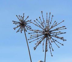 a large metal sculpture on top of a building