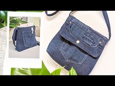 a blue purse sitting on top of a white table next to a green leafy plant