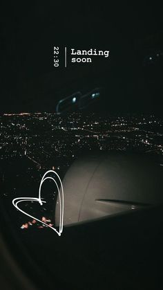 an airplane wing with the words landing soon written in white on it's side