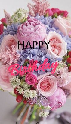 a bouquet of flowers with the words happy birthday written in pink, blue and red