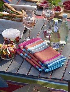 the table is set with many different types of food and drinks