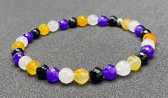 Genuine faceted multi colored jade beads come together to create the Nonbinary Pride flag. Beads are 6mm. Bracelet is 6.75 inches inner diameter and made with crystal stretch elastic cord. Nonbinary Bracelet, Nonbinary Jewelry, Pride Flag Bracelet, Spiritual Multicolor Faceted Beaded Bracelets, Nonbinary Flag, Flag Beads, Pride Jewellery, Pride Bracelet, Purple Jade