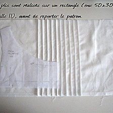 a piece of white paper with writing on it and some pieces of fabric next to it