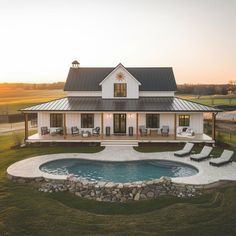 a white house with a pool in the front yard and covered patio area next to it