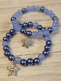 Silver Snowflake Charm on a Blue Beaded Stretch Bracelet ✨ Features: Material: Blue beads, detailed snowflake charms Size: Stretchable to fit most wrist sizes comfortably 📦 Shipping & Returns: Processing Time: 1-3 business days Shipping: Fast and reliable shipping options available Returns: Hassle-free returns within 30 days of purchase ✨ Care Instructions: To maintain the beauty of your bracelets, avoid exposure to water, perfumes, and harsh chemicals. Clean gently with a soft cloth when neede Winter Bracelets Diy, Glass Beaded Bracelets Aesthetic, Seed Bead Stretch Bracelets, Winter Inspired Jewelry, Blue Crystal Beaded Bracelet, Cute Hypoallergenic Blue Beaded Bracelets, Festive Blue Beaded Bracelet, Beaded Charms, Cute Beaded Bracelets