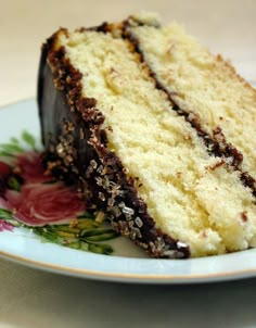 a piece of cake sitting on top of a blue and white plate with flowers around it