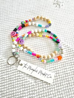 Our colorful + fun lanyards are sure to impress. They are lightweight, durable and here's the BEST PART... no two are ever exactly the same. The beads are pastels and bright happy colors. We mix in wooden and trendy shape beads for a unique vibe! They can be customized upon request with dainty letter beads. Perfect for teachers, students, co-workers, friends or even as a stocking stuffer! Follow me on IG and TikTok @thememphismarketco WHAT YOU WILL RECEVE: 1 colorful beaded lanyard with attachme Cheap Fun Multicolor Lanyards, Cheap Keychain Lanyards For Teacher Appreciation, Cheap Multicolor Beaded Lanyards, Everyday Multicolor Lanyards With Keychain, Multicolor Fun Craft Supplies For Teacher Appreciation, Fun Multicolor Craft Supplies For Teacher Appreciation, Multicolor Lanyards With Key Leash For Everyday Use, Trendy Multicolor Lanyards For Everyday Use, Multicolor Lanyards With Key Leash For Personal Use