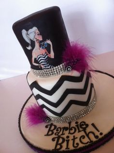 a birthday cake with a top hat and purple feathers on the bottom is decorated in black, white and pink