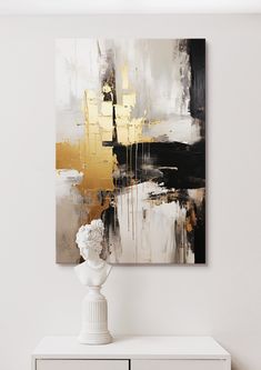 an abstract painting hangs on the wall above a white dresser with a vase in front of it