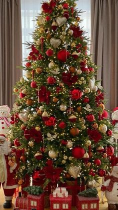 a christmas tree decorated with red and gold ornaments