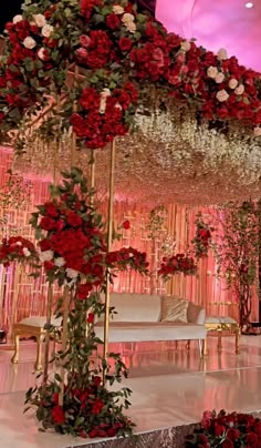 a decorated stage with red and white flowers