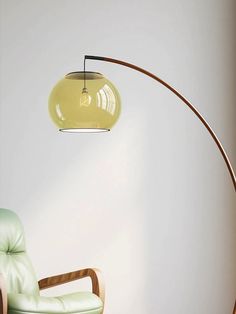 The Joni Arc floor lamp is inspired by 180 House and is a great choice for large living spaces. Supported by a green metal base, it features a slender arched frame made from metal that rises to an amber glass sphere. PRODUCT NOTES D 45cm x H 160cm / ∅ 17.7″ x H 63″. (59" plug cord) Glass Lampsheade: D 30cm / ∅ 11.8″ Green, Brown, Amber. SKU: RDF-151918 MATERIALS Metal lamp body, Glass lampshade. E26 or E27 socket. (Not included bulbs) SPEC SHEET INSTALLATION Curved Standing Lamp, Hanging Floor Lamp Living Room, Beachy Floor Lamp, Statement Floor Lamp, Aesthetic Floor Lamp, Green Floor Lamp, Mcm Lamp, Arch Floor Lamp, Mid Century Floor Lamps