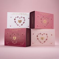 three valentine's day greeting cards in pink and white with gold hearts on them