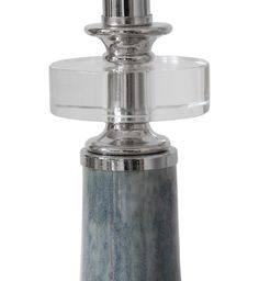 a glass and metal candle holder on a white background