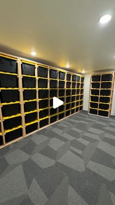 an empty room with shelves and carpeted flooring