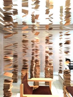 a room filled with lots of books floating in the air