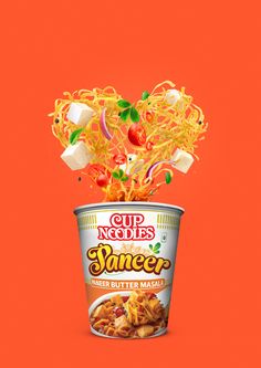 a cup of noodles with vegetables falling out of it on an orange background and the caption says soup noodle summer