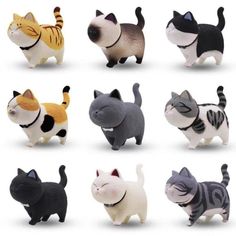 many different types of cat figurines are shown