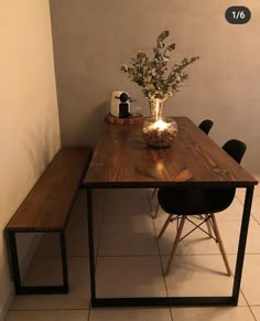 a wooden table sitting next to a black chair